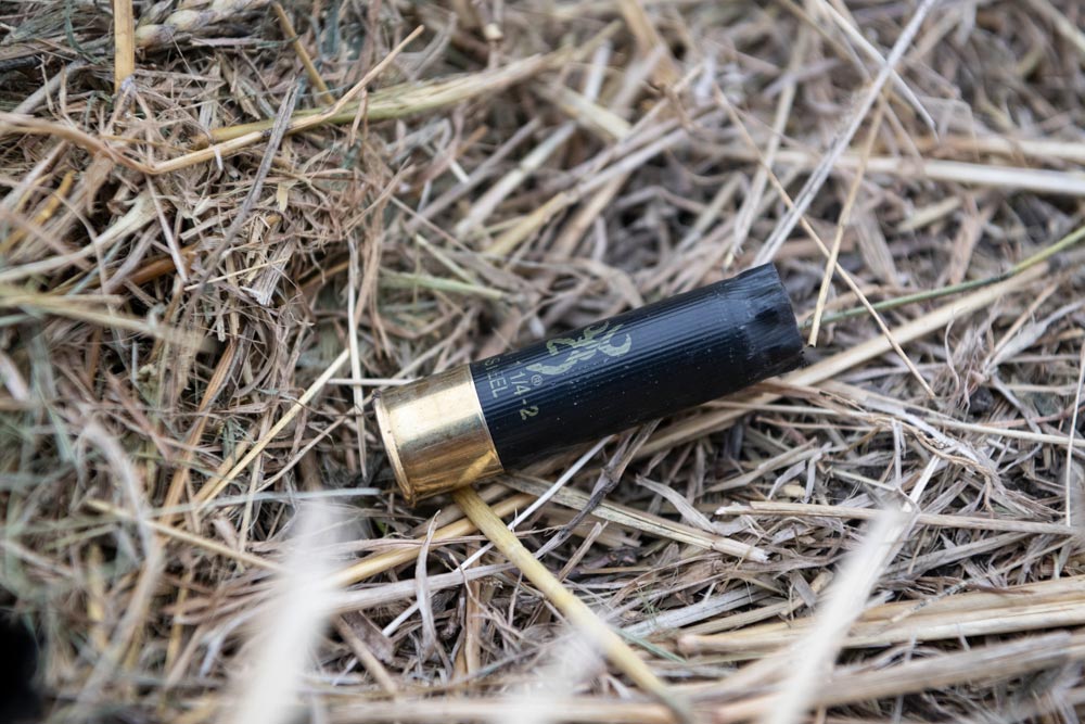 a spent browning shotgun shell on the ground