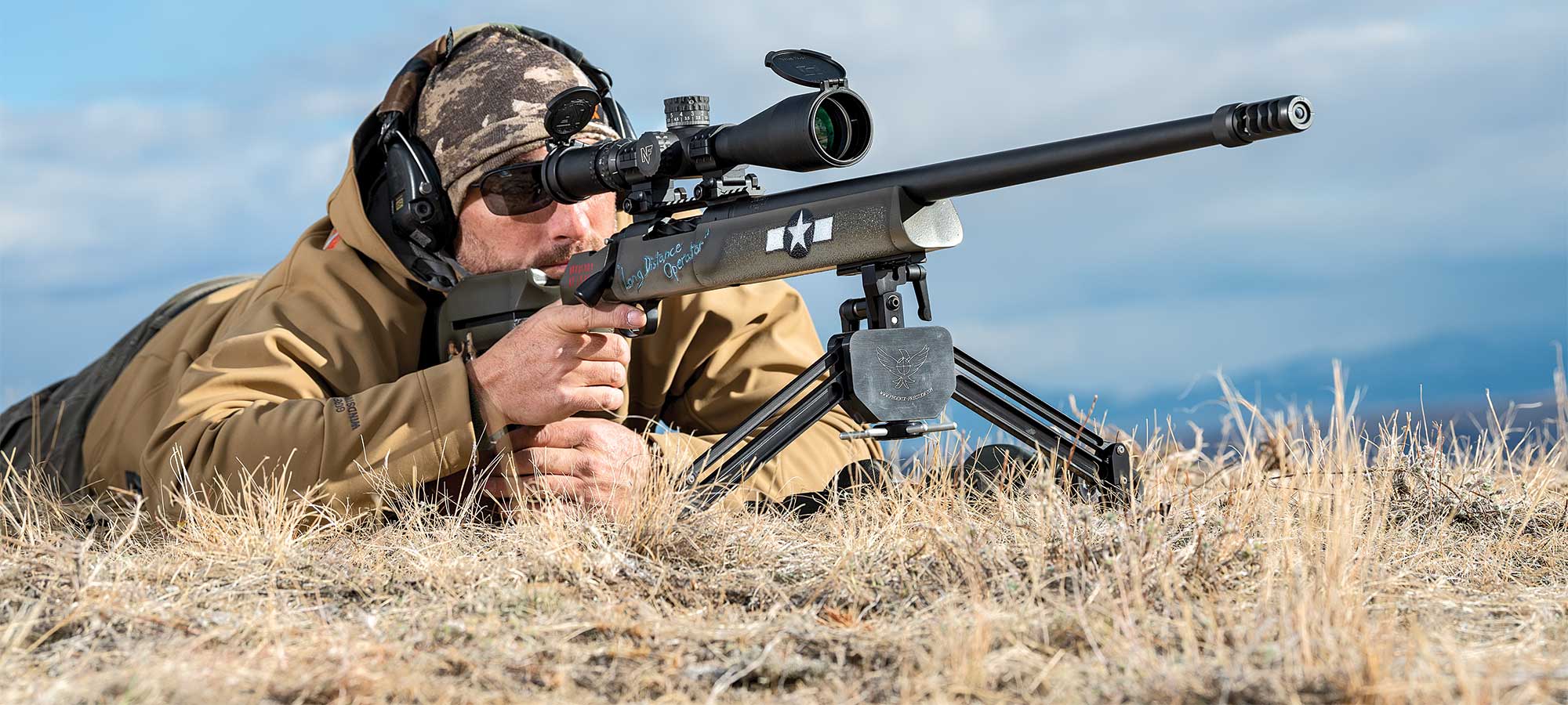 shooter aiming long range rifle
