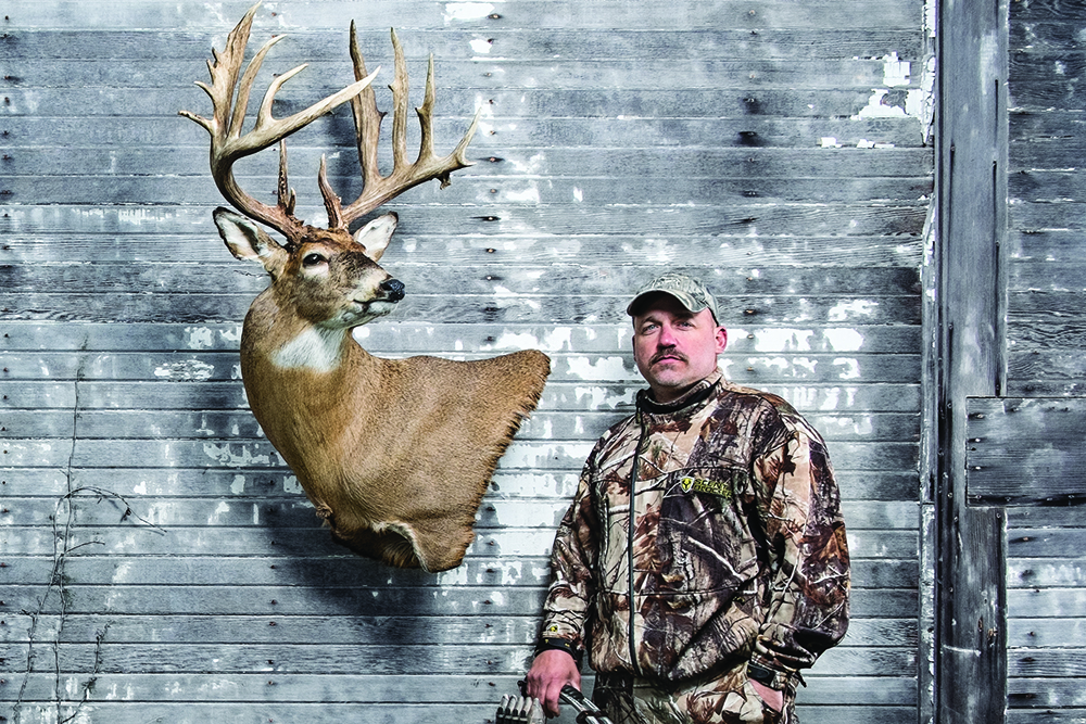 <em>Ohio bowhunter Mark Sharp with his 216-inch buck, Outdoor Life’s 2014 Deer of the Year. Photographs by Vincent Soyez.</em>