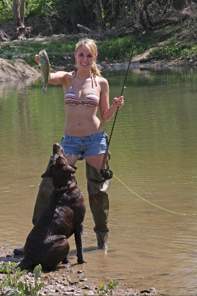 Katie Woods and Ben, her chocolate lab caught a largemouth bass on the Brazos River in China Spring, TX.