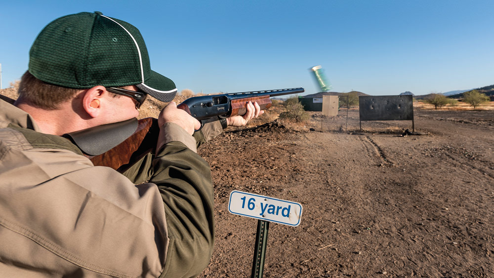 Bird hunter checks shotgun POI after installing cheekpiece