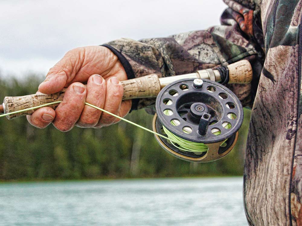 closeup of fly fishing rod and reel