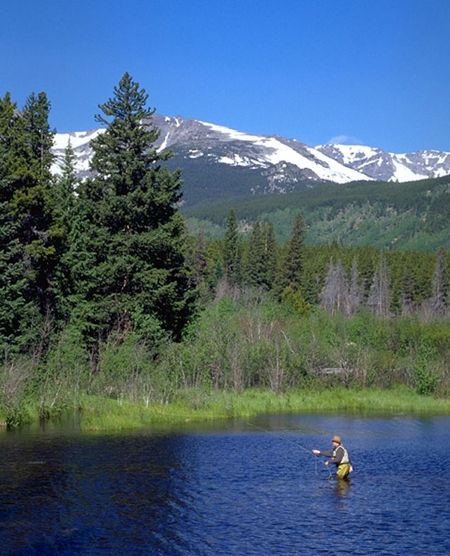a man fishing rocky mountain national park