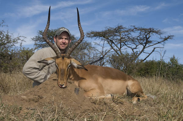 Success! With the wind in his favor, Tim was able to drop this awesome impala ram in his tracks at 90 yards.