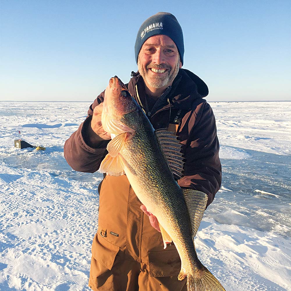 Ross Grothe with a tip-up-caught- Mille Lacs walleye