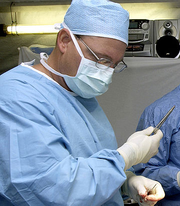 surgeon handing scapel