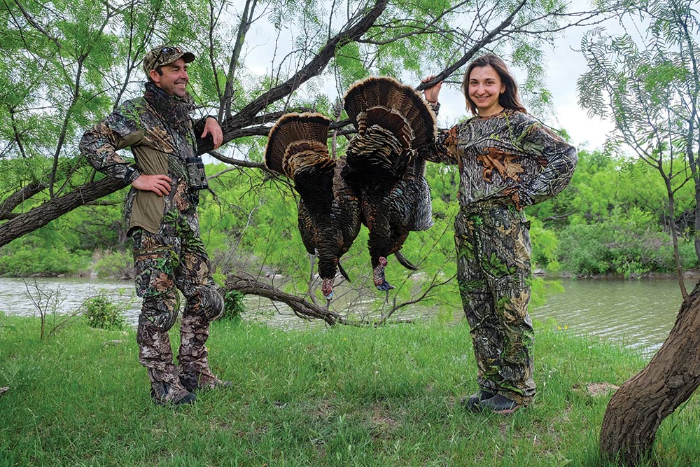 Andrew McKean and Hilary Ribons with two tom turkeys