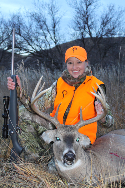 As a Montana resident, Julie lives in a hunter's paradise. As you can tell from this photo, her aim is equally good with a big-game rifle.