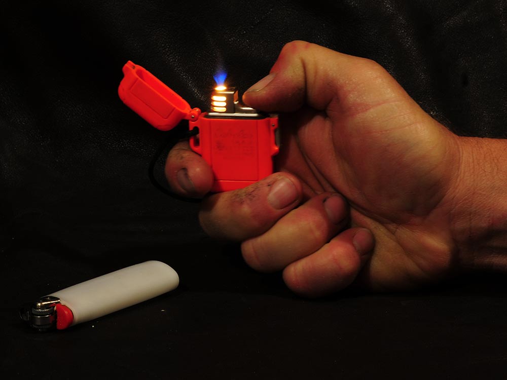 hand lighting a lighter