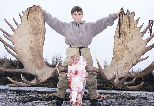 Young Jack Nelson toppled this goliath bull near Alaska's Aniak River, while guided by his father Dean Nelson. The moose is number six in SCI, and scores 618 3/8 inches.