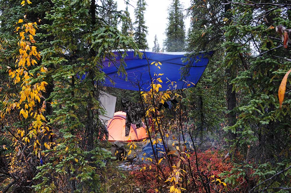 a tarp hanging over a campsite
