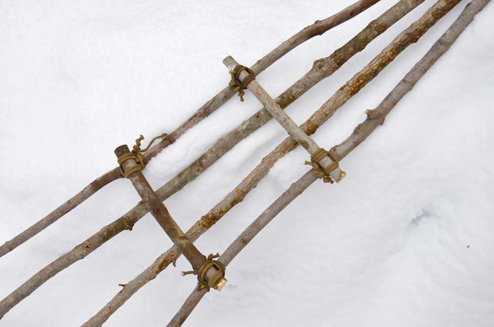 cross pieces of sticks lashed together