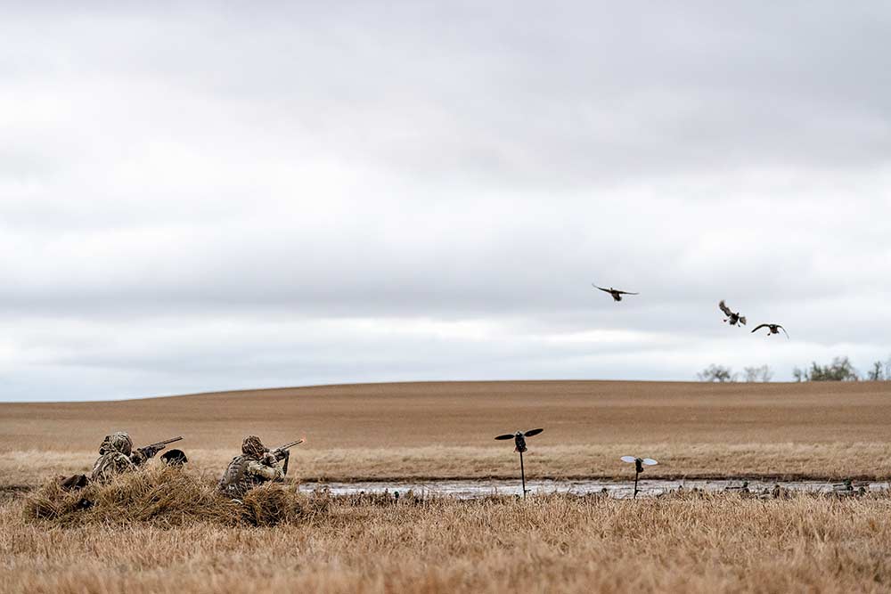 waterfowl hunters in a field