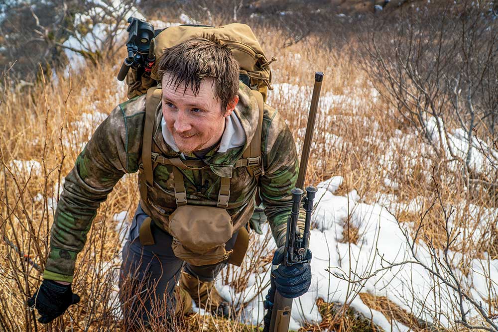 hunter hiking through the kodiak island