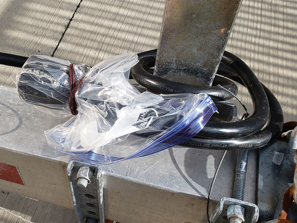 trailer electrical plugs wrapped in plastic
