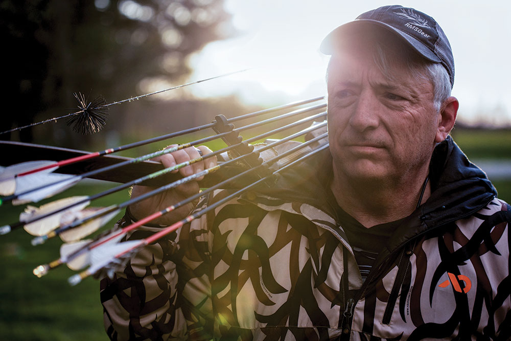 tom clum sr with a bow and arrows slung over his shoulder