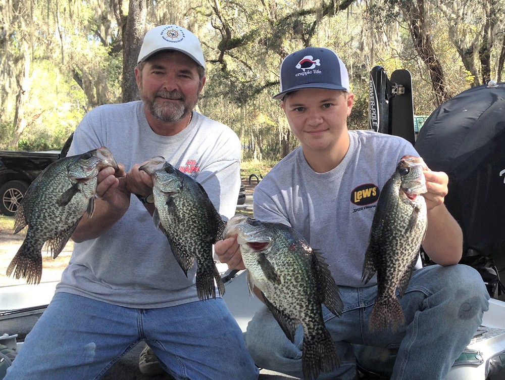 father and son fishing crappies