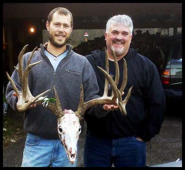 bob decker poses with deer skull and antlers