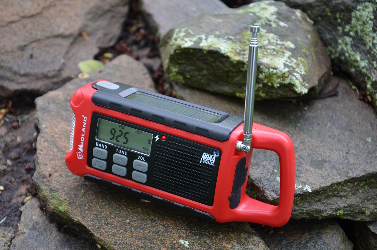 a red midland portable radio