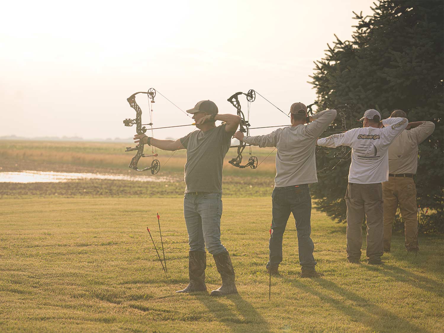bowhunters aiming compound bows