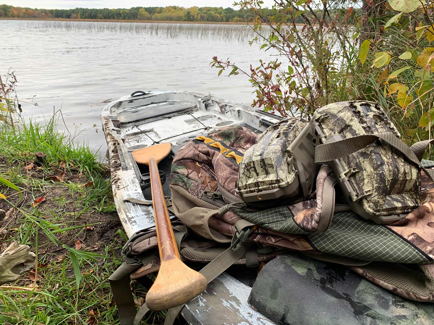 a fishing kayak filled with hunting gear