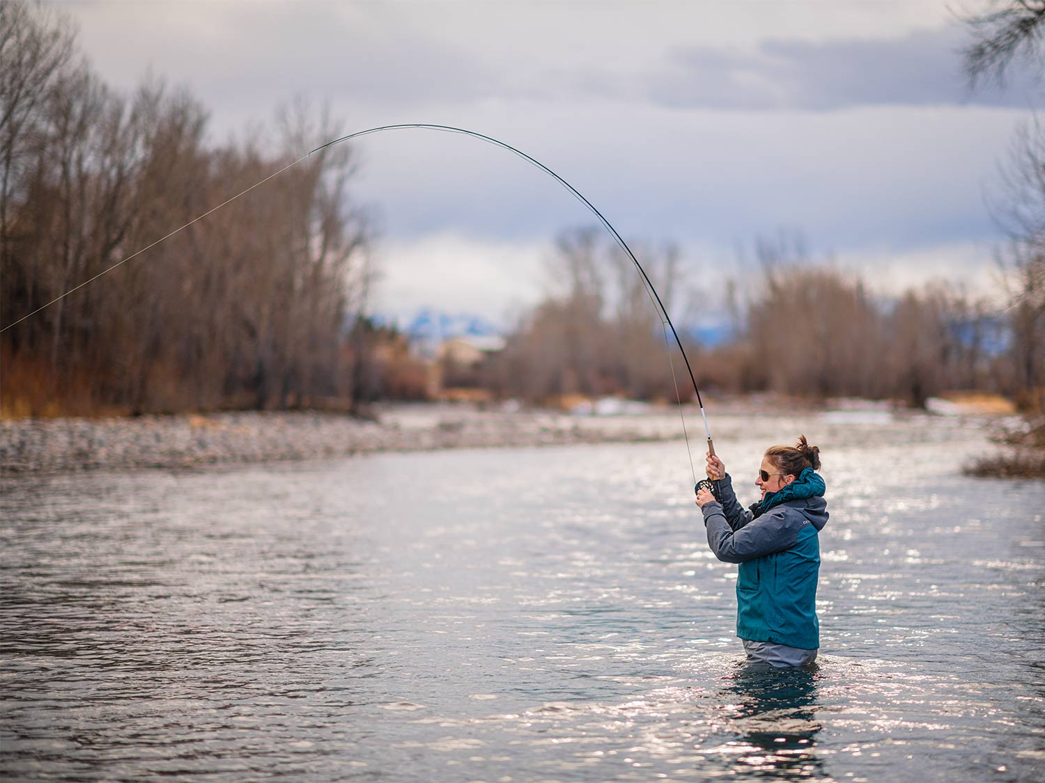 Female angler fishing in the Montana Boulder River.