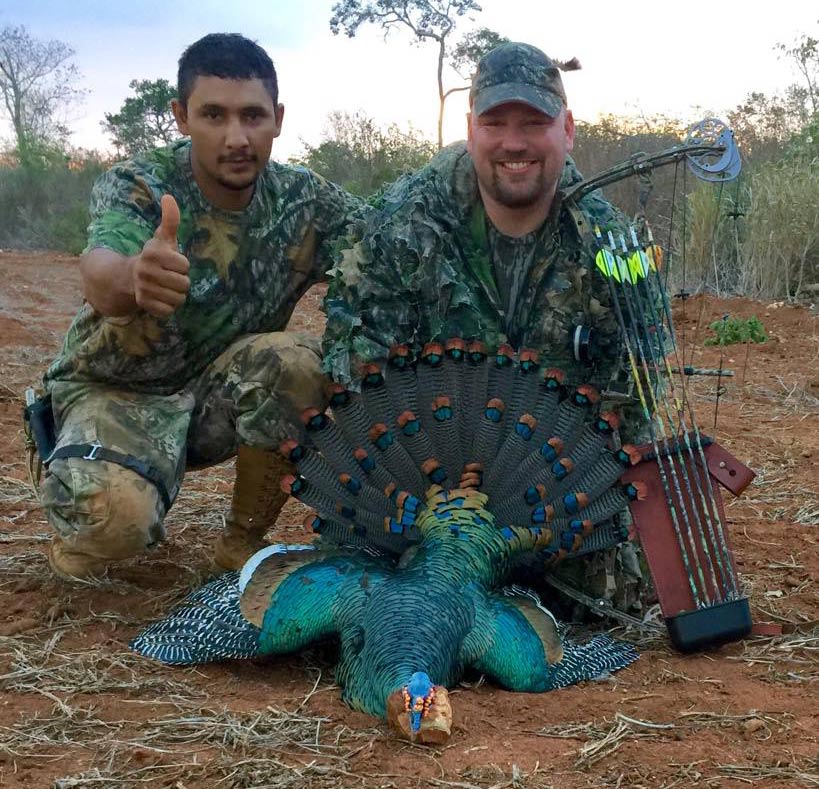 Jason Hart with a bowkilled Ocelatted gobbler.