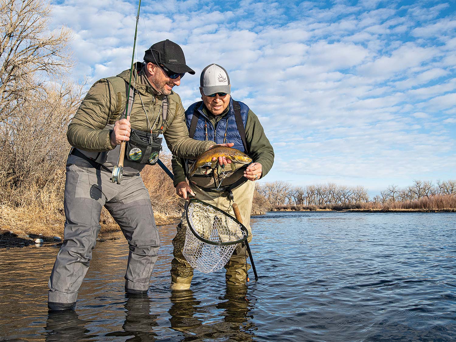Two anglers fishing trout in Montana's Bighorn River.