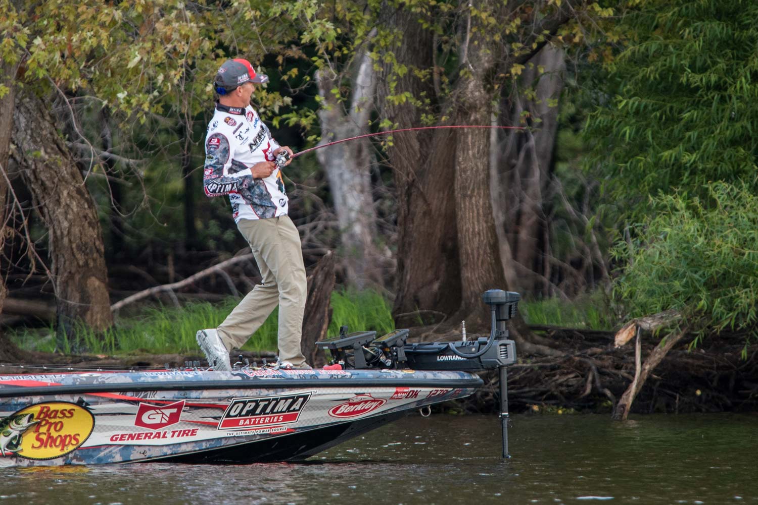 Edwin Evers fishing off the front of a Bass Pro sport fishing boat.