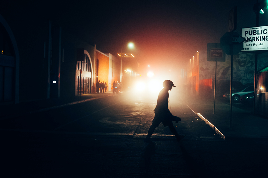 person walking in dark