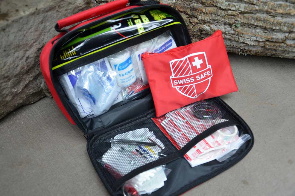 A well-packed first aid kit with supplies.
