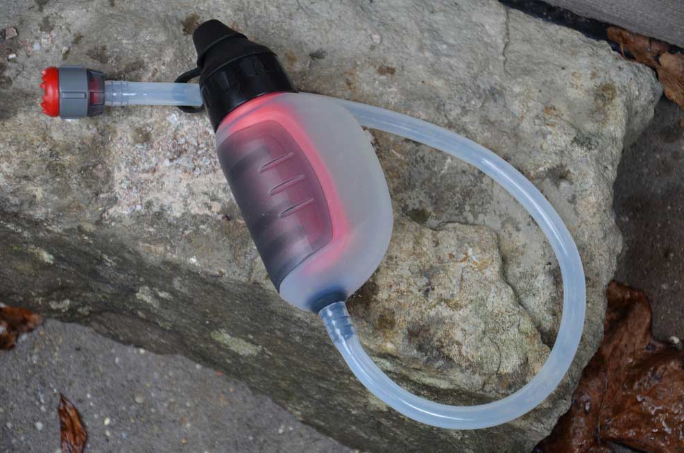 A water filtration tube system on a rock.