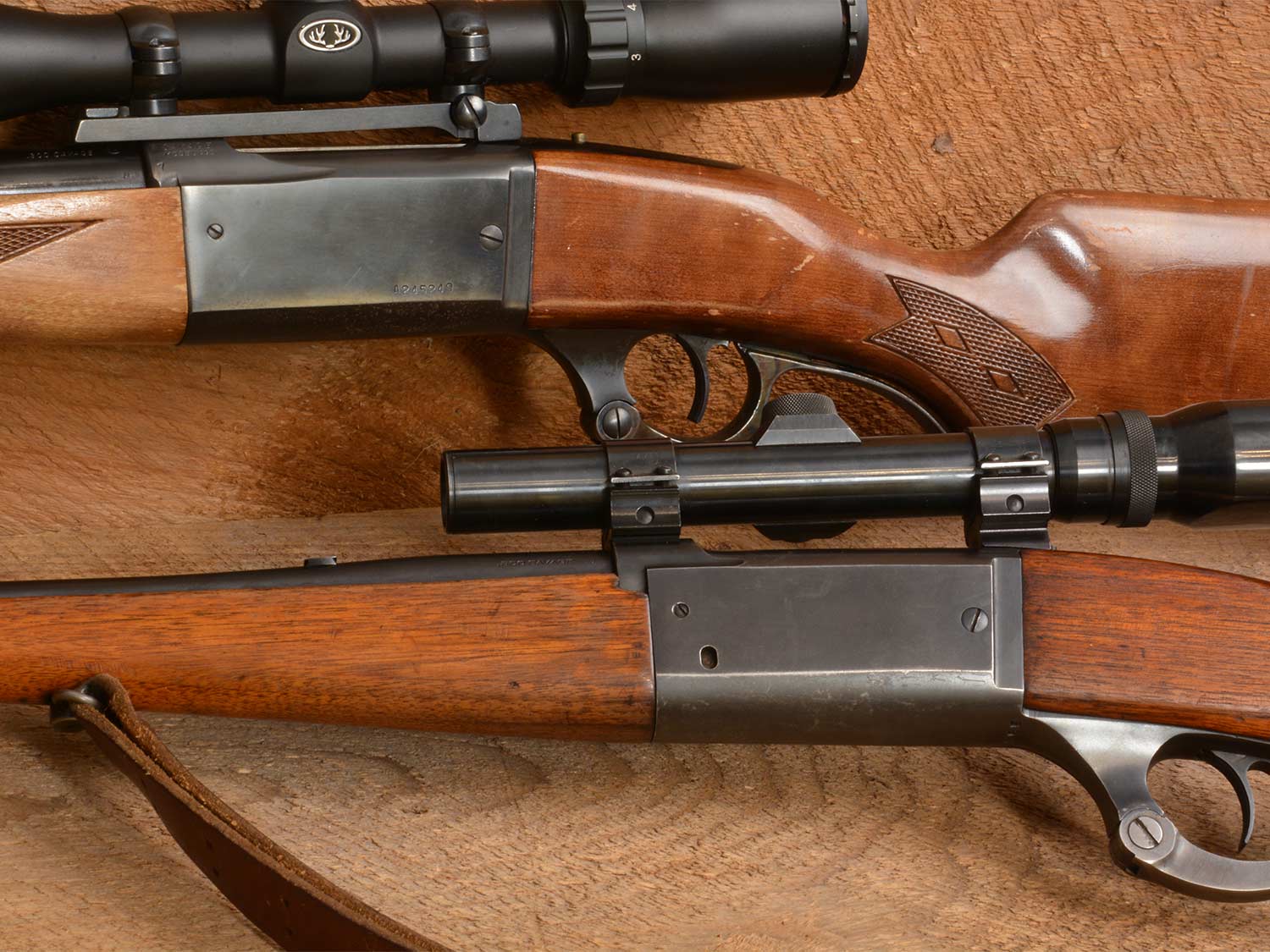 Close up details of variant models of the Savage Model 99 lever action rifle.