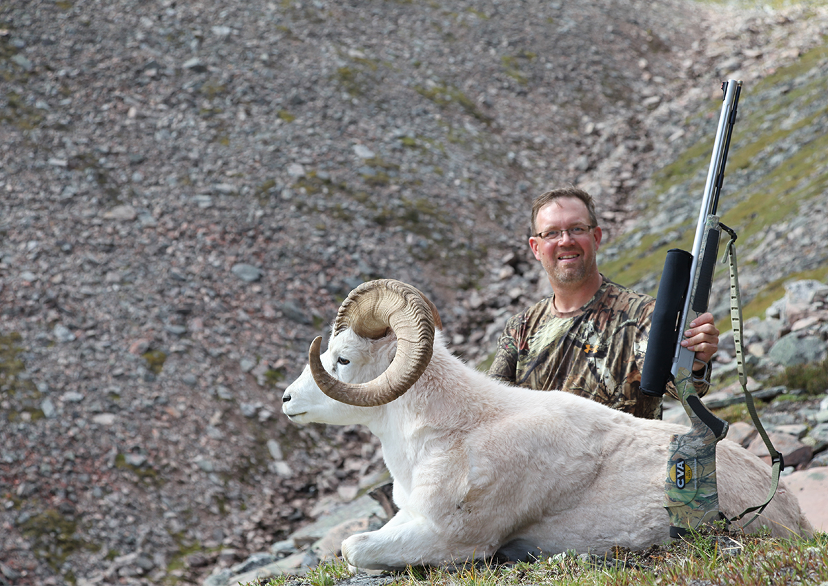 Hunter with sheep he shot with one of the best muzzleloaders.