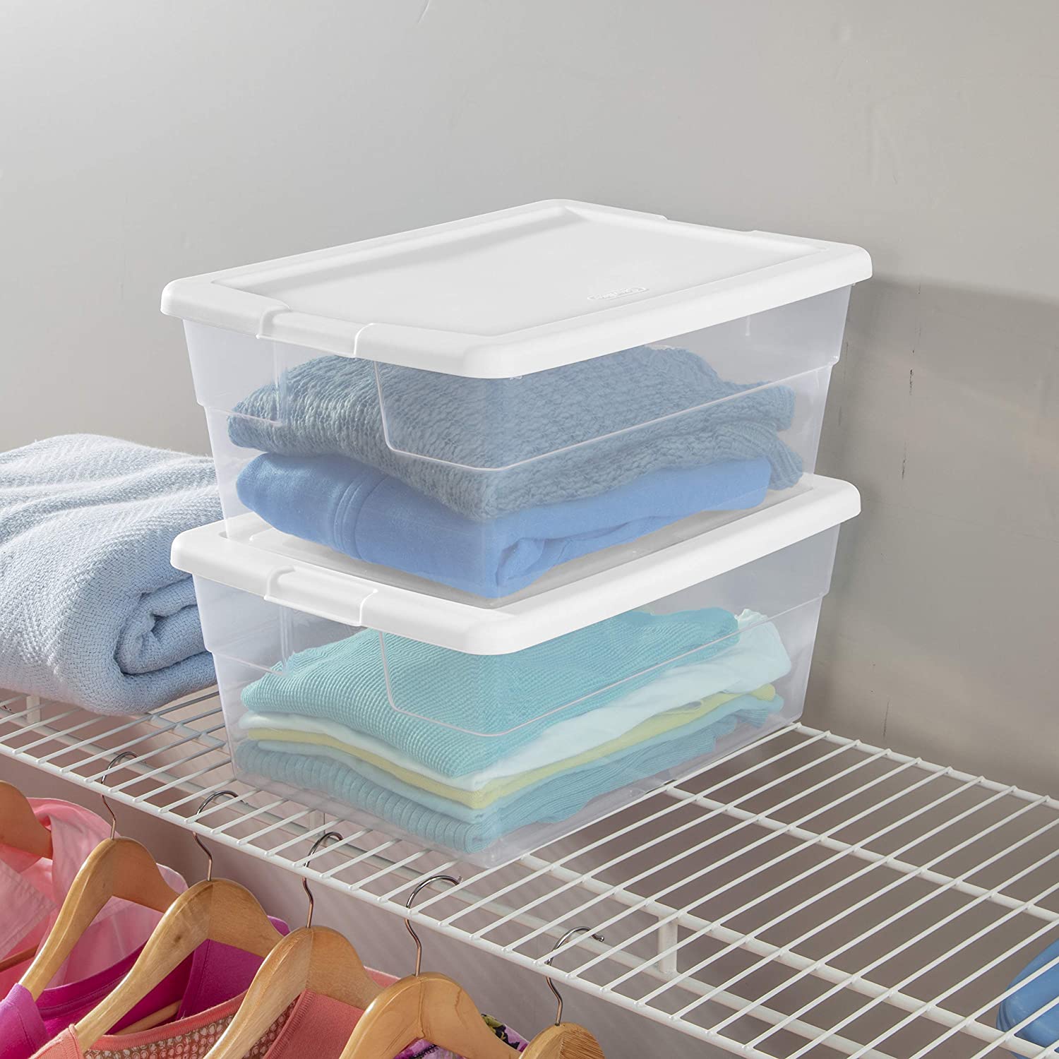 Stackable plastic storage bins with white lids