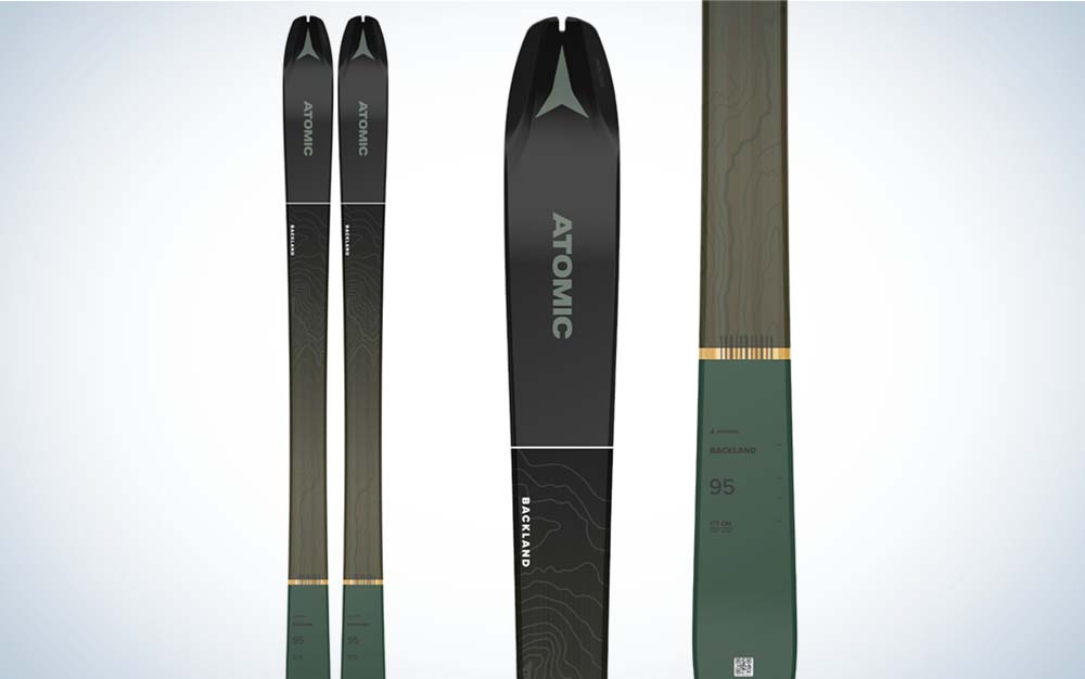 A pair of black nad green best backcountry skis