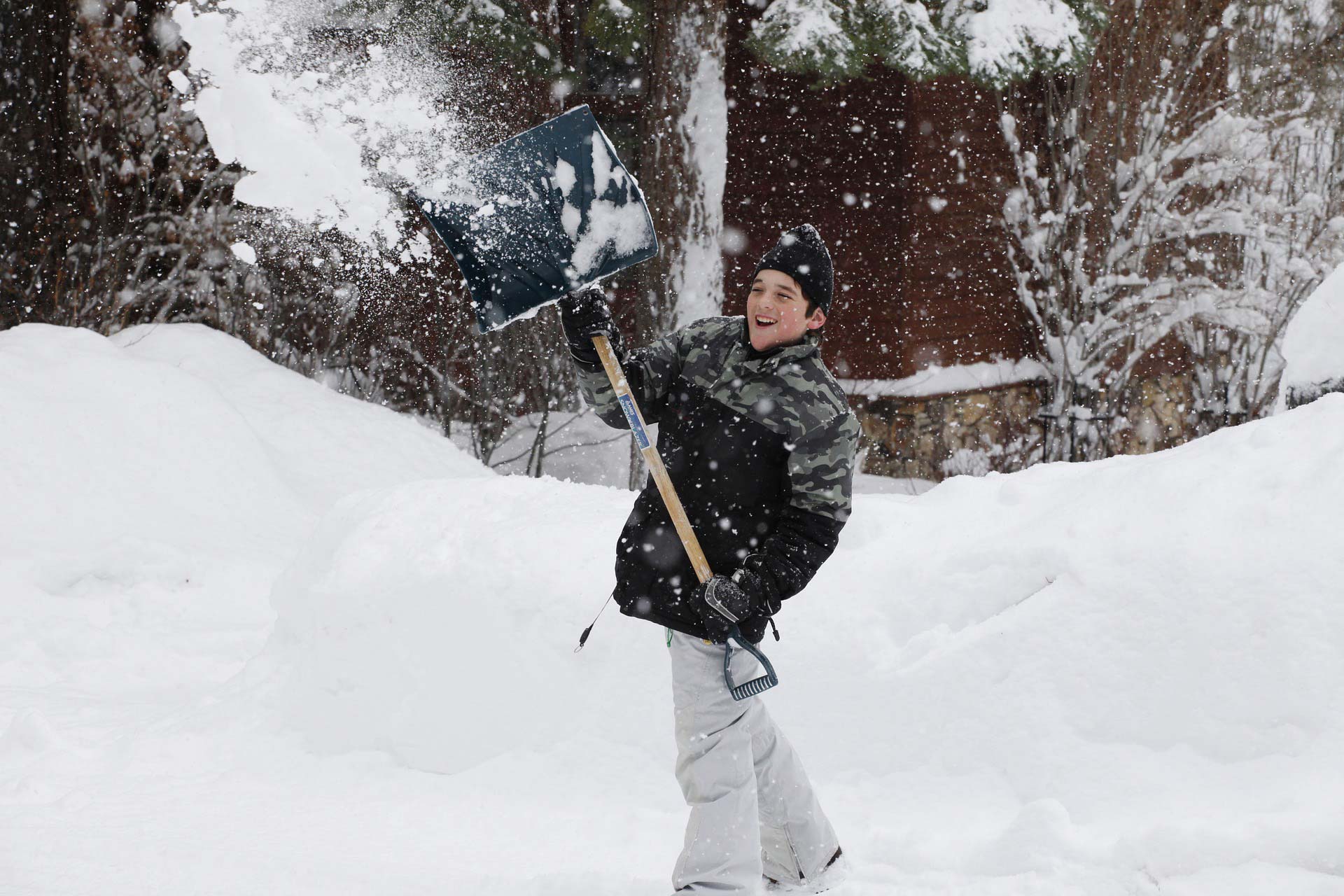 Guy shoveling snow