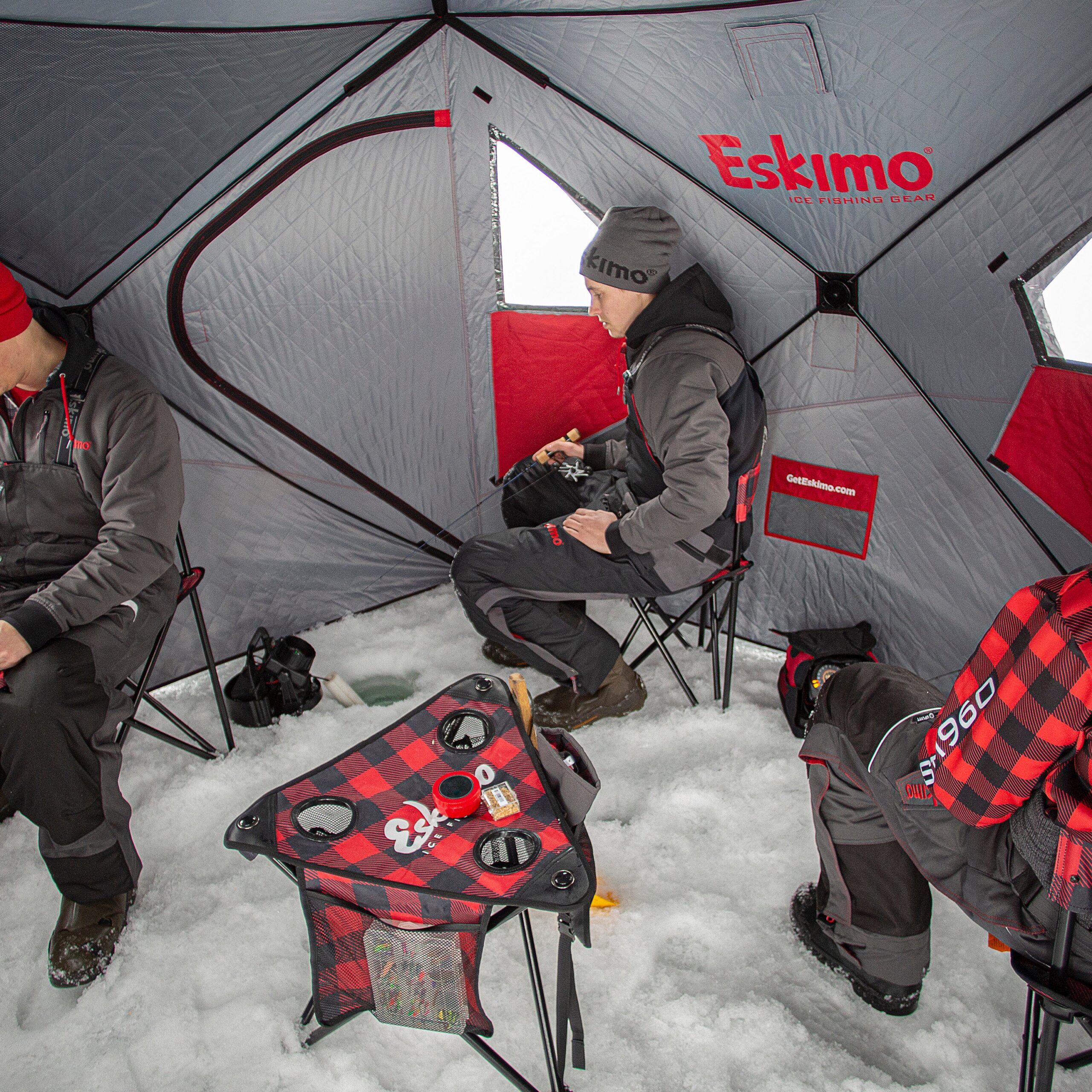 Three anglers sit in the Eskimo Outbreak 450.