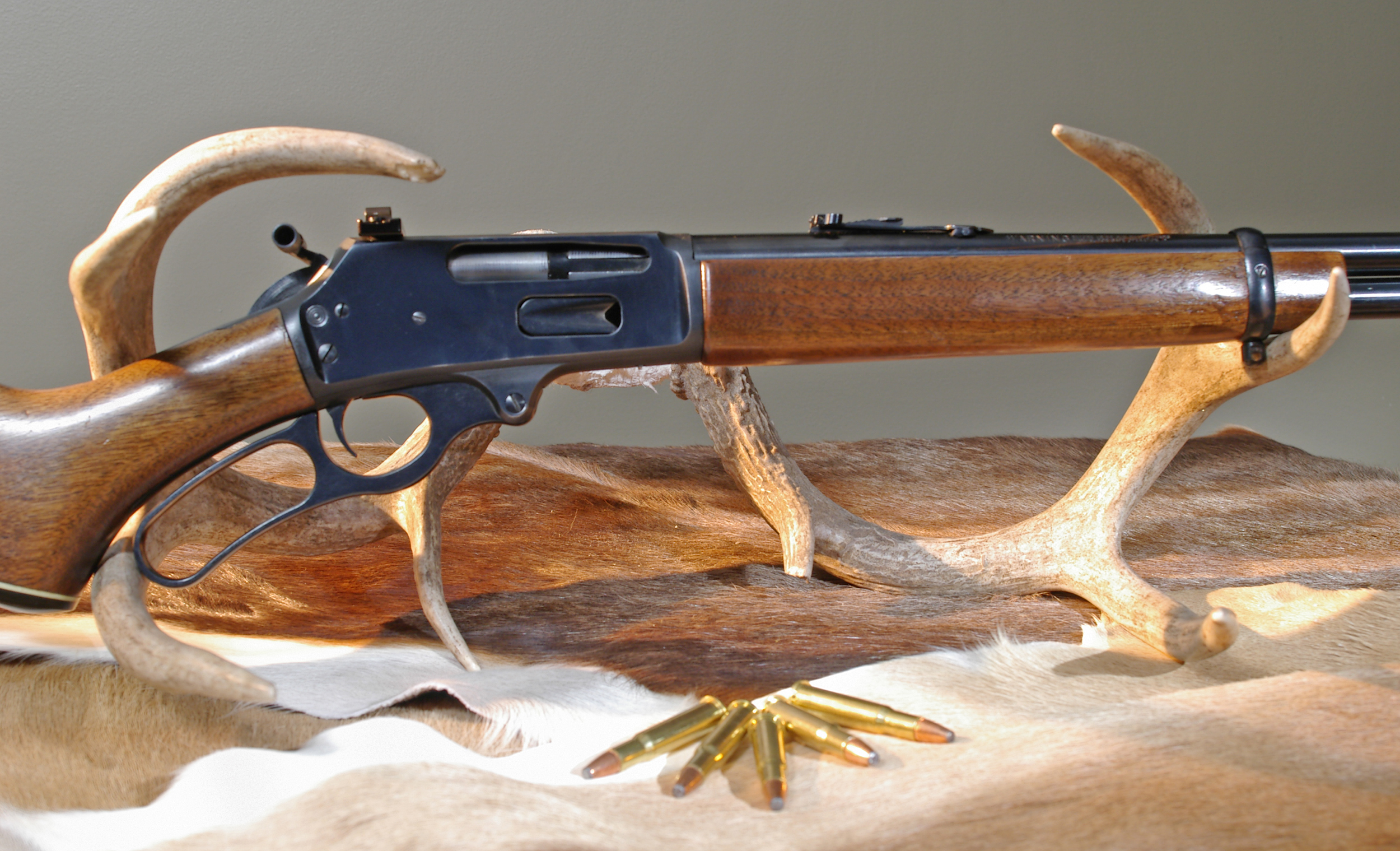 Marlin M336 with ammo, is a classic rifle.