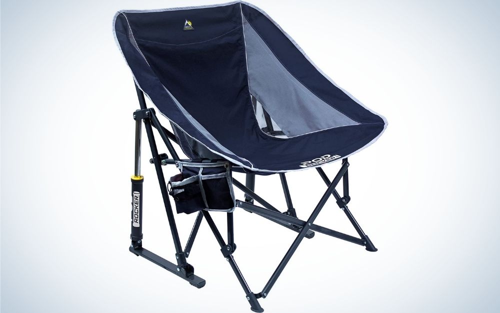 A blue portable outdoor rocking chair arched seat that folds flat for storage and transportation with a small bag and
