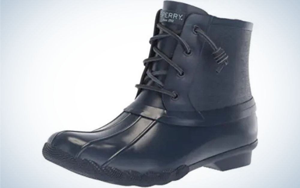 Navy rubber sole material boots with laces for fastening from side.
