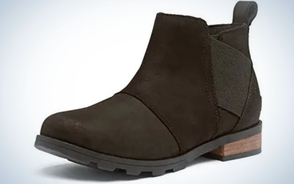 Dark brown full-grain leather boots with flat brown wooden heel from side.