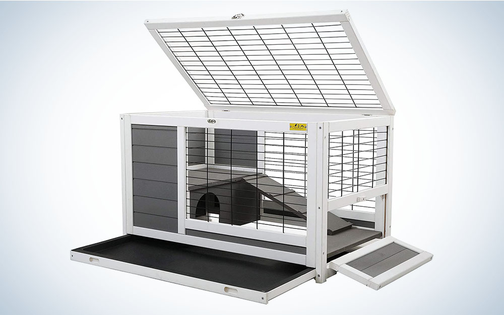 A white and gray bunny hutch with a removable tray and wire fencing.