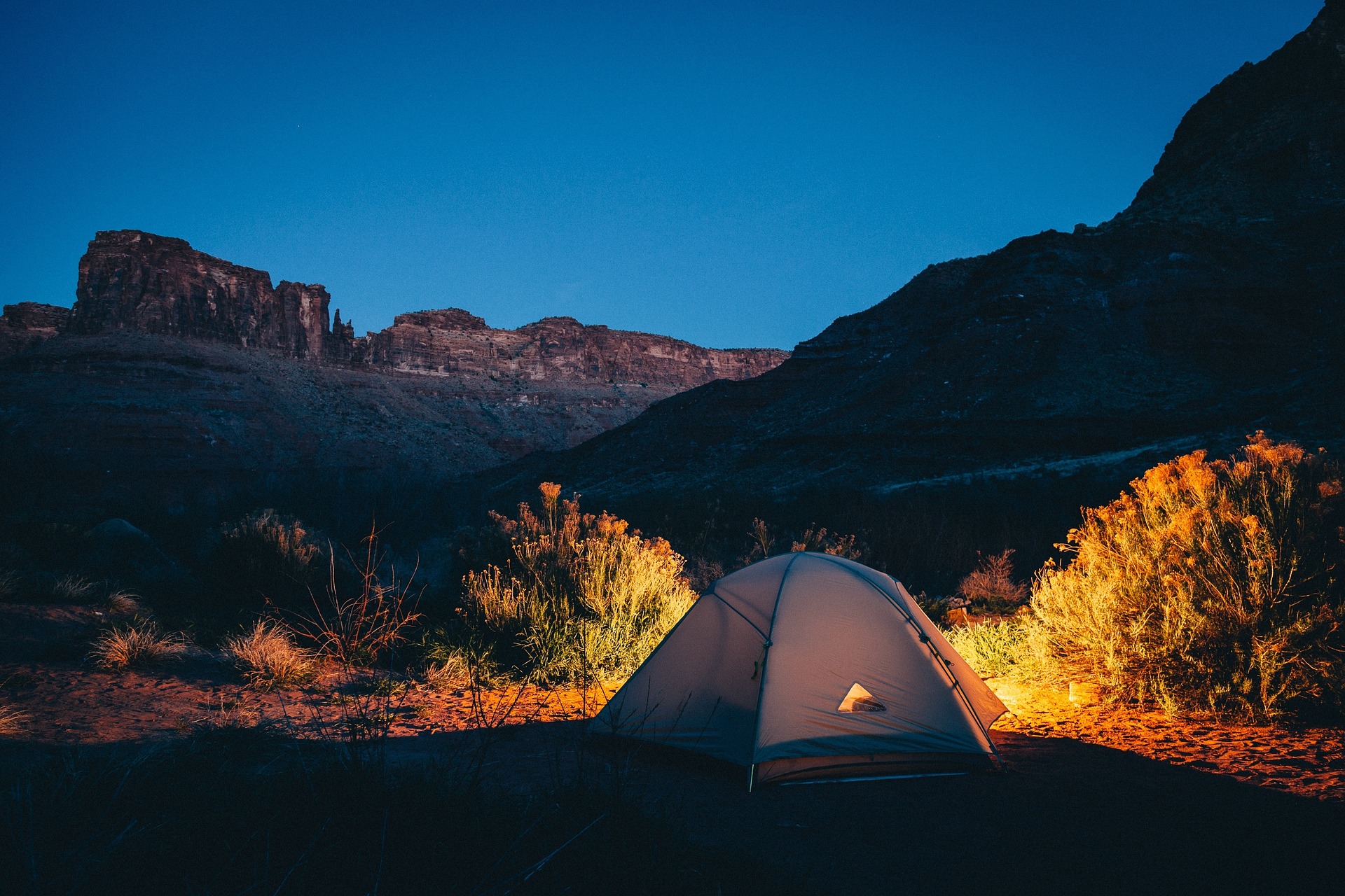 Keep the bugs away while camping by selecting the right location.