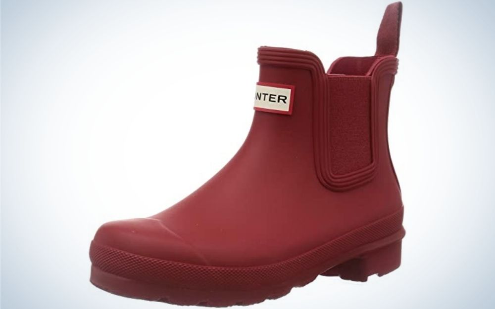 A matte plastic boots in cherry color and with the brand name on it.