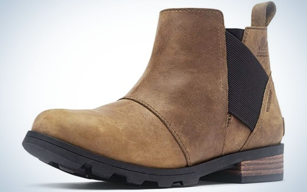 A winter brown boot with a strong black sole and a black elastic on the side of the boot.