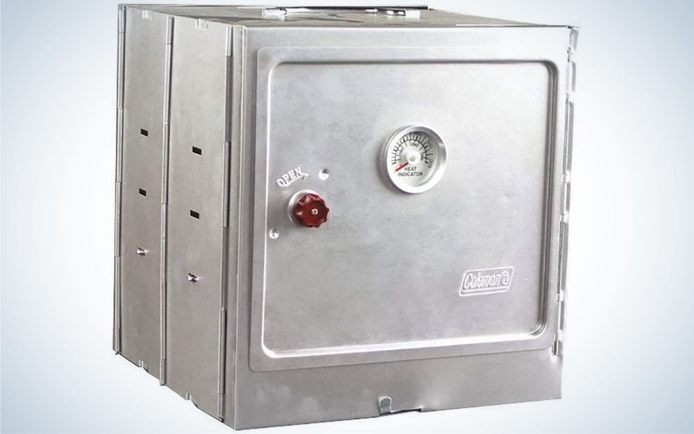 A silver square camp oven with a graduation mark in front of it.
