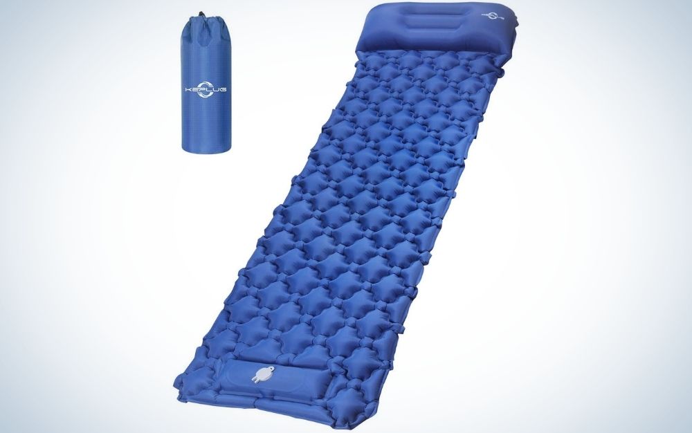 An all-blue sleeping bag with a solid material in the shape of a square mattress.
