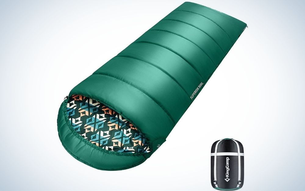 A sleeping bag for camping thick and green in color as a large quilt cover.