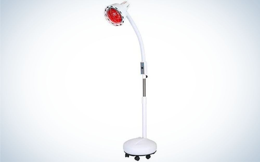 A red-headed lamp with a thin white body and a support leg with moving wheels.